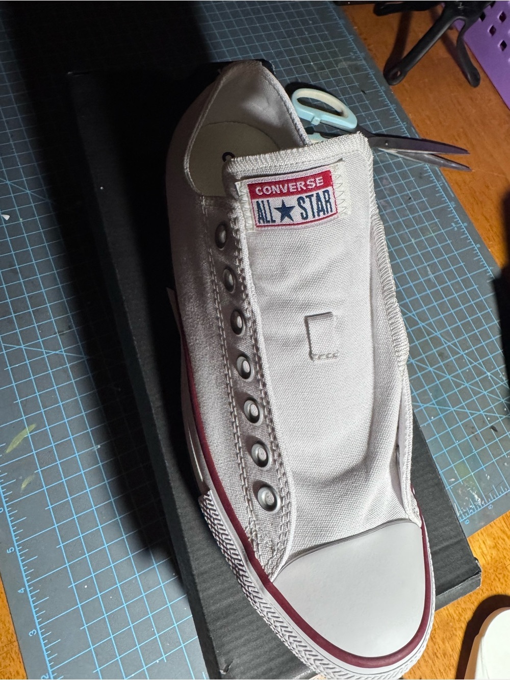 Converse White Canvas Slip-On Sneaker with Burgundy Trim